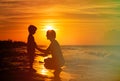 Father and son holding hands at sunset Royalty Free Stock Photo