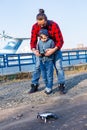 Father and son holding remote control joystick and piloting quadrocopter Royalty Free Stock Photo