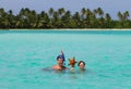 Father and son holding a starfish on a tropical beach Royalty Free Stock Photo