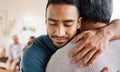 Father, son and hug for love, care or support in family bonding or time together in living room at home. Happy man Royalty Free Stock Photo