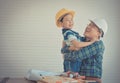 Father Son HUG for success concept in construction industry concept in vintage tone