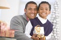 Father And Son Hugging,Holding Christmas Gift Royalty Free Stock Photo