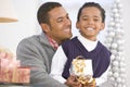 Father And Son Hugging,Holding Christmas Gift Royalty Free Stock Photo