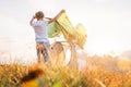 Father and son install tent for camping on sunny forest glade Royalty Free Stock Photo