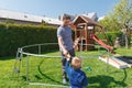 Father and son when installing large garden trampolines.