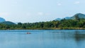 Father and son kayaking on the lake somewhere in Kanchanaburi, Thailand Royalty Free Stock Photo