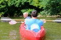 Father and son kayaking on the river Royalty Free Stock Photo