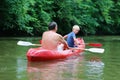 Father and son kayaking on the river Royalty Free Stock Photo