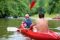 Father and son kayaking on the river Royalty Free Stock Photo