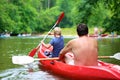 Father and son kayaking on the river Royalty Free Stock Photo