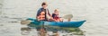 Father and son kayaking at tropical ocean. BANNER, long format