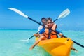 Father and son kayaking at tropical ocean Royalty Free Stock Photo