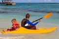Father and son kayaking at tropical ocean Royalty Free Stock Photo