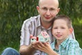 Father and son keeping in their hands wendy house