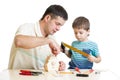 Father and son kid making wooden nesting box Royalty Free Stock Photo
