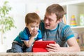 Father and son kid play with tablet computer Royalty Free Stock Photo