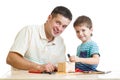 Father and son kid tinkering nesting box Royalty Free Stock Photo