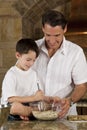 Father and Son In Kitchen Cooking Baking Cookies Royalty Free Stock Photo