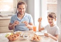 Father and son in kitchen Royalty Free Stock Photo