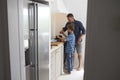 Father And Son In Kitchen Making Meal Together Royalty Free Stock Photo