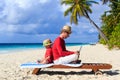 Father and son with laptop on vacation Royalty Free Stock Photo