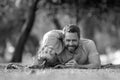 Father and son laying on grass in nature park. People having fun outdoors. Concept of happy vacation and friendly family Royalty Free Stock Photo