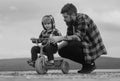Father and son learning to ride a bicycle. Little boy learn to ride a bike with his daddy. Dad teaching child boy to Royalty Free Stock Photo
