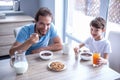 Father and son in kitchen Royalty Free Stock Photo