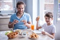 Father and son in kitchen Royalty Free Stock Photo