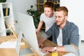 father and son looking at computer Royalty Free Stock Photo