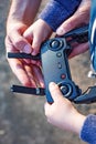 Father and son looking at remote control joystick and piloting quadrocopter Royalty Free Stock Photo