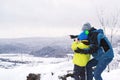 Father and son looking to mountains in winter nature. Kid looking to monocular. Family winter holidays. Father and son having fun Royalty Free Stock Photo