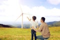 Father with son looking at wind energy turbines Royalty Free Stock Photo