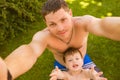 Father with son making selfie on the grass Royalty Free Stock Photo