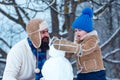 Father and son making snowman in the snow. Handmade funny snowman. Christmas holidays and winter new year with father Royalty Free Stock Photo