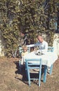 Father and son at outdoor cafe. Man smile to his baby boy in restaurant. Family relations of parent and kid enjoying Royalty Free Stock Photo