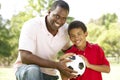 Father And Son In Park With Soccer Ball Royalty Free Stock Photo