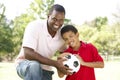 Father And Son In Park With Soccer Ball Royalty Free Stock Photo