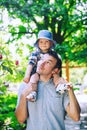 Father with son in the park at spring time on the background of