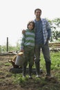 Father And Son With Pig In Sty Royalty Free Stock Photo