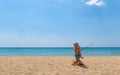 Father and son play with badminton racket and shuttlecock on the beach. Royalty Free Stock Photo