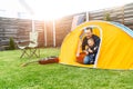 Father and toddler son camped in the backyard