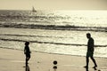 Father and son play soccer or football on the beach. Family travel, vacation, father's day concept. Dad and child Royalty Free Stock Photo