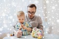 Father and son playing with ball clay at home Royalty Free Stock Photo