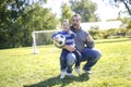 Father and Son Playing Ball in The Park