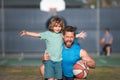 Father and son playing basketball. Concept of healthy holiday and family activity.