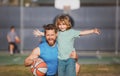 Father and son playing basketball. Concept of healthy holiday and family activity.