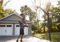 Father And Son Playing Basketball On Driveway At Home Royalty Free Stock Photo