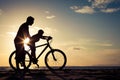 Father and son playing on the beach at the sunset time. Royalty Free Stock Photo