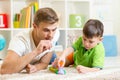 Father And Son Playing With Blocks At Home Royalty Free Stock Photo